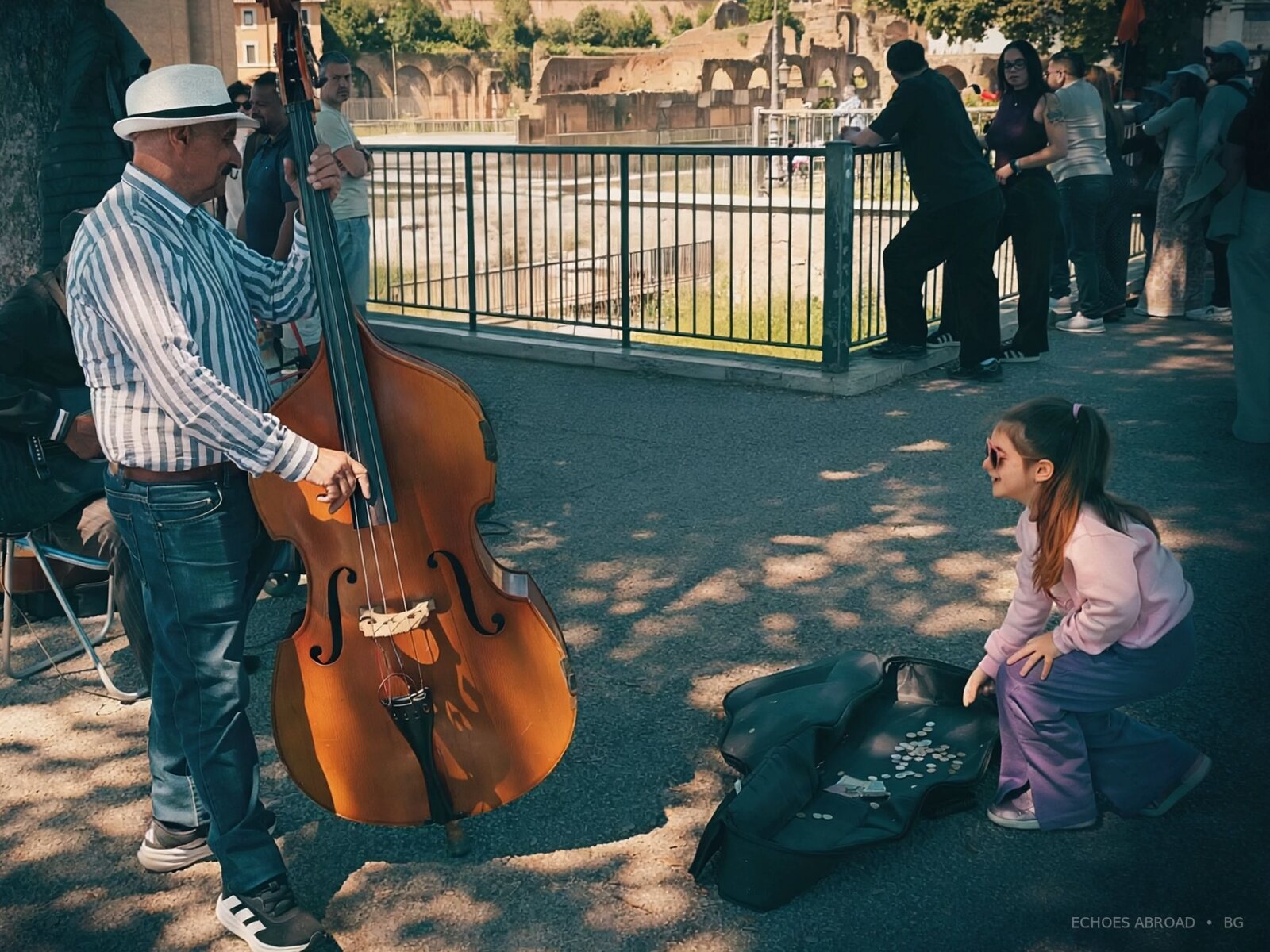 A spontaneous exchange between a street musician and a child
